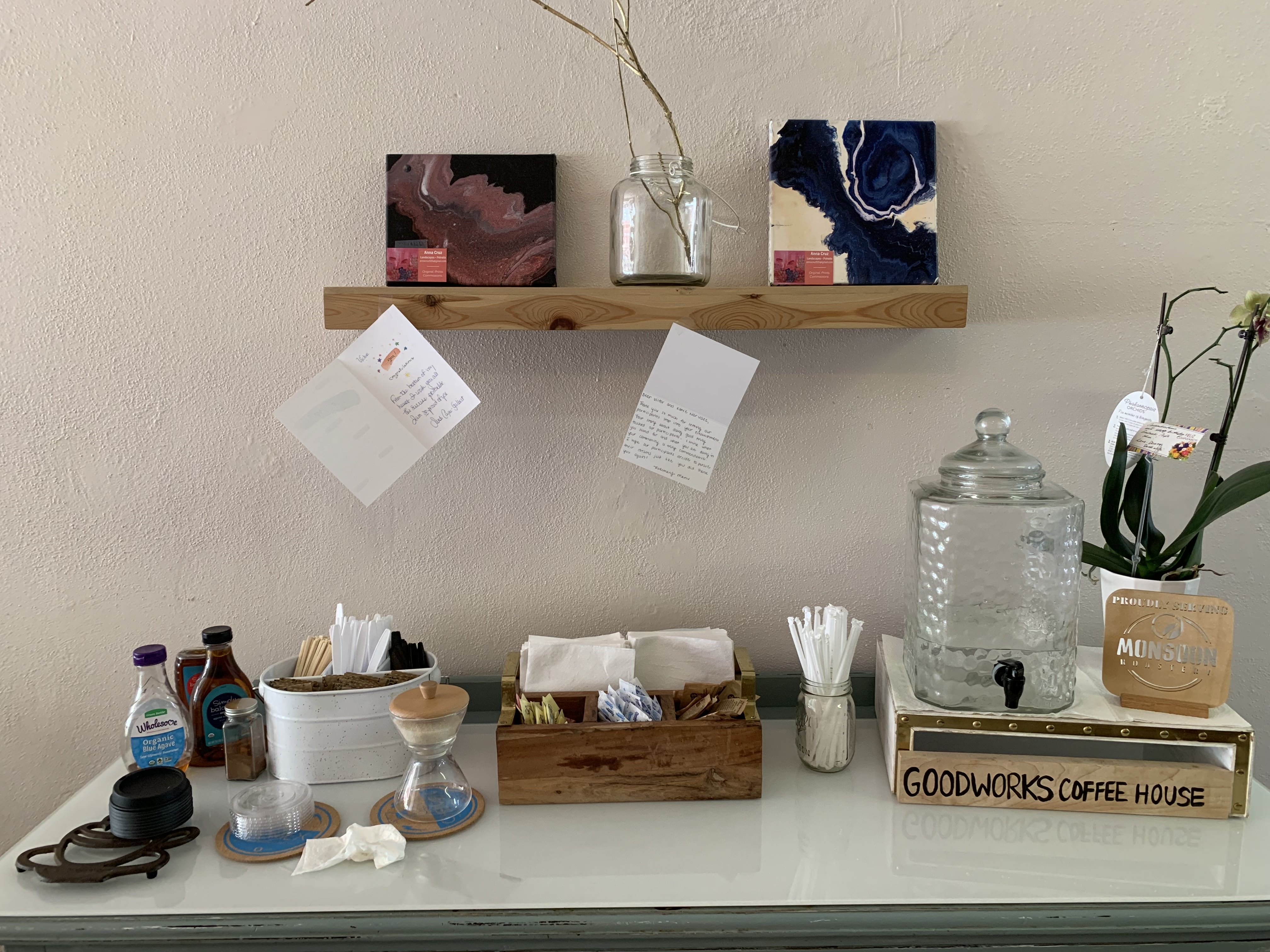 Coffee area with lids, sugar, and napkins
